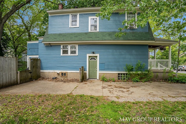 1212 Johnston St SE, Grand Rapids, MI 49507 - rear view of house featuring a chimney