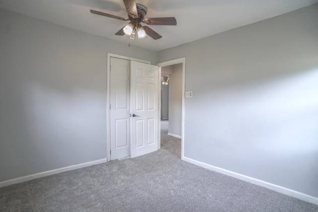 879 Carberry Rd, Niles, MI 49120 - unfurnished bedroom with carpet flooring, a closet, and ceiling fan