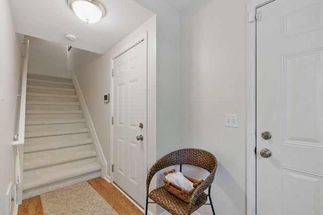 9285 Nature View Ln, Ypsilanti, MI 48197 - doorway with stairway, light wood-style flooring, and baseboards