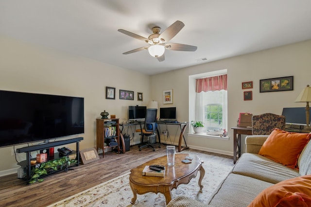 9285 Nature View Ln, Ypsilanti, MI 48197 - living area with wood finished floors, a ceiling fan, a desk, and baseboards