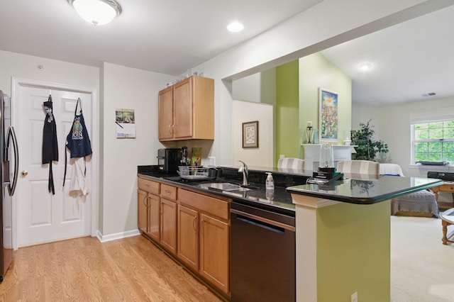 9285 Nature View Ln, Ypsilanti, MI 48197 - kitchen with dishwashing machine, a peninsula, a sink, light wood-type flooring, and a breakfast bar area