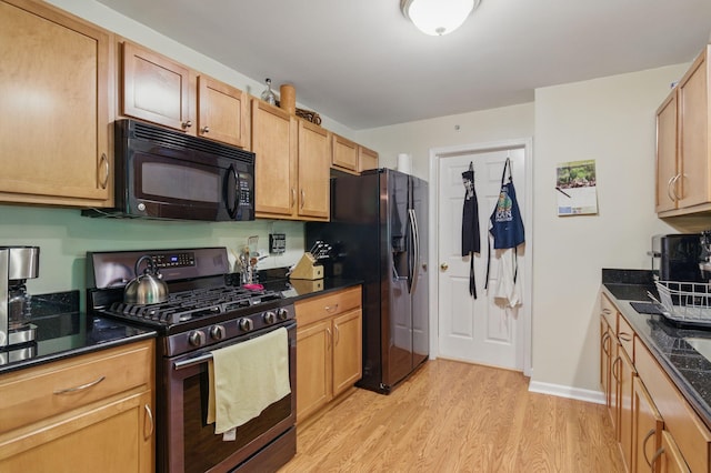 9285 Nature View Ln, Ypsilanti, MI 48197 - kitchen featuring black microwave, gas stove, refrigerator with ice dispenser, light wood-type flooring, and baseboards