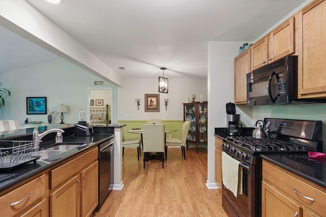 9285 Nature View Ln, Ypsilanti, MI 48197 - kitchen featuring black appliances, light wood finished floors, a sink, and dark stone counters