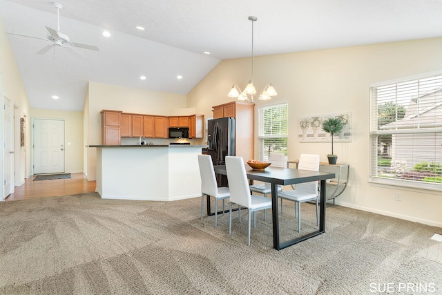 3107 Rain Tree Ct Unit 36, Hudsonville, MI 49426 - dining area featuring light carpet, a chandelier, baseboards, recessed lighting, and high vaulted ceiling