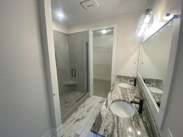 2583 Ravines Trail Dr SW, Byron Center, MI 49315 - full bath with a shower stall, marble finish floors, double vanity, and a walk in closet