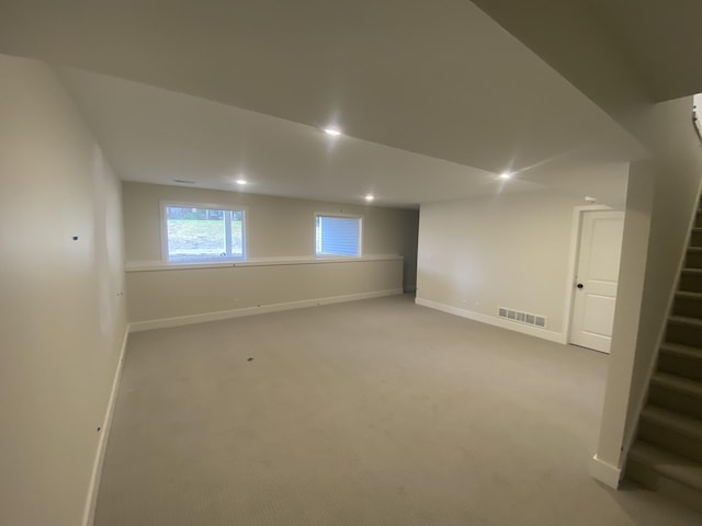 2583 Ravines Trail Dr SW, Byron Center, MI 49315 - below grade area with stairway, baseboards, carpet, and recessed lighting