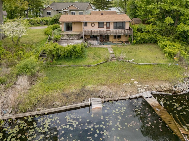 12391 Sunset Dr, Plainwell, MI 49080 - back of property with a deck with water view, a lawn, and stairway