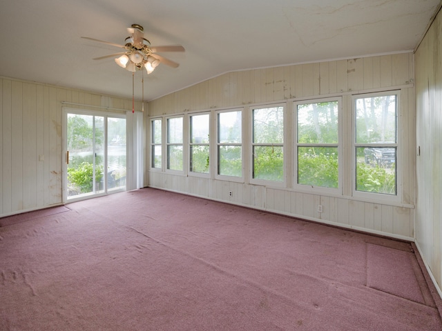 12391 Sunset Dr, Plainwell, MI 49080 - unfurnished sunroom with wood walls, lofted ceiling, and carpet