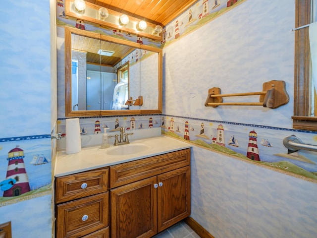 12391 Sunset Dr, Plainwell, MI 49080 - bathroom with wooden ceiling, vanity, and wallpapered walls