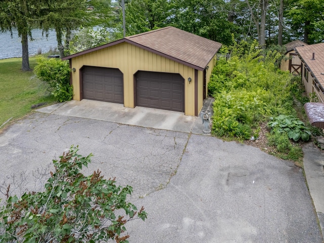 12391 Sunset Dr, Plainwell, MI 49080 - detached garage featuring view of wooded area