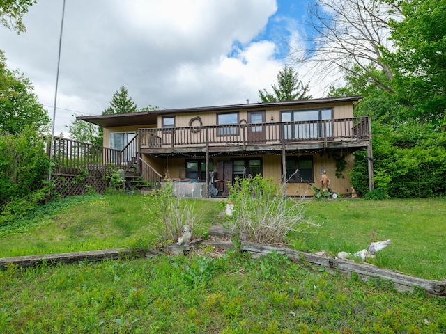 12391 Sunset Dr, Plainwell, MI 49080 - rear view of property featuring a wooden deck, a yard, and stairway