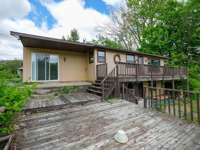 12391 Sunset Dr, Plainwell, MI 49080 - view of front of home with a wooden deck and stairs