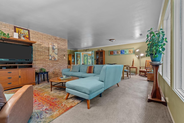 1119 Wesaw Rd, Niles, MI 49120 - living room featuring brick wall, carpet floors, and baseboards
