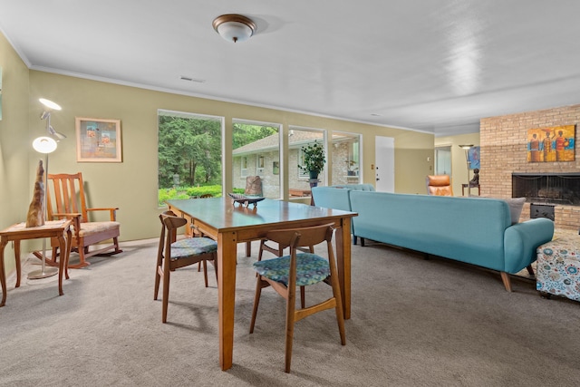 1119 Wesaw Rd, Niles, MI 49120 - dining space featuring light colored carpet, crown molding, and a fireplace