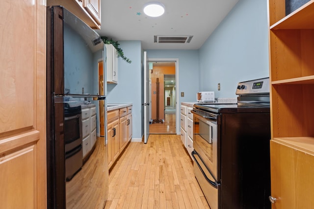 1119 Wesaw Rd, Niles, MI 49120 - kitchen featuring stainless steel range with electric stovetop and light wood-style flooring