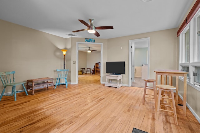 1119 Wesaw Rd, Niles, MI 49120 - living area featuring ceiling fan, light wood-style flooring, and baseboards