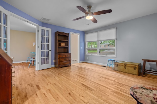 1119 Wesaw Rd, Niles, MI 49120 - unfurnished room with french doors, wood finished floors, a ceiling fan, and baseboards
