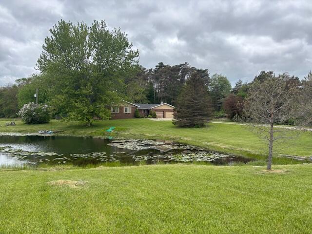 18593 30th Ave, Barryton, MI 49305 - view of green lawn featuring a water view