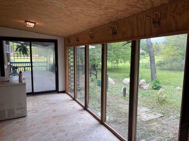 18593 30th Ave, Barryton, MI 49305 - unfurnished sunroom with vaulted ceiling and plenty of natural light