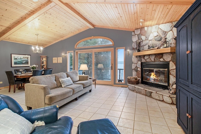 6818 W Vesper Dr, Ludington, MI 49431 - living area with light tile patterned floors, a chandelier, a stone fireplace, wooden ceiling, and baseboards