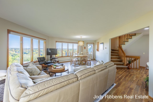 226 Sunset Ave NW, Grand Rapids, MI 49504 - living room with wood finished floors, stairs, and baseboards
