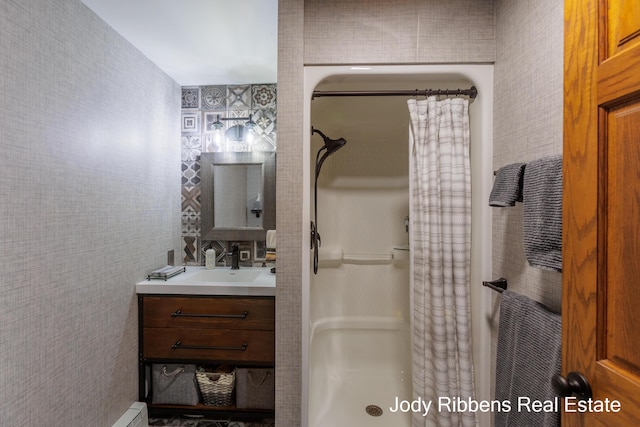 226 Sunset Ave NW, Grand Rapids, MI 49504 - full bath featuring a stall shower, vanity, and wallpapered walls
