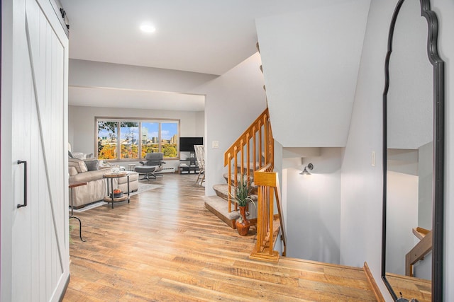 226 Sunset Ave NW, Grand Rapids, MI 49504 - foyer featuring wood finished floors, stairway, and recessed lighting