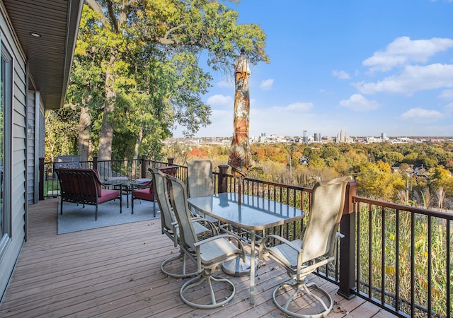 226 Sunset Ave NW, Grand Rapids, MI 49504 - wooden deck featuring outdoor dining space