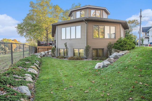 226 Sunset Ave NW, Grand Rapids, MI 49504 - rear view of property with a wooden deck