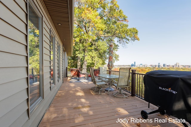 226 Sunset Ave NW, Grand Rapids, MI 49504 - wooden terrace featuring area for grilling, outdoor dining area, and a view of city