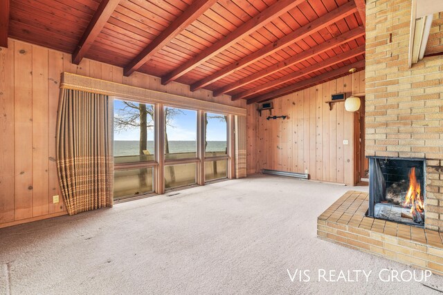 17933 N Shore Estates Rd, Spring Lake, MI 49456 - unfurnished living room with wooden ceiling, a baseboard heating unit, wood walls, carpet floors, and a water view