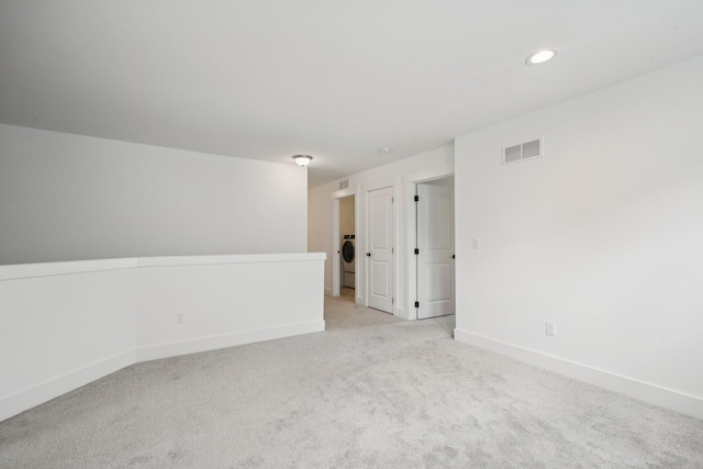 331 Honey Tree Way, Ann Arbor, MI 48103 - spare room featuring light carpet, recessed lighting, and washer / dryer