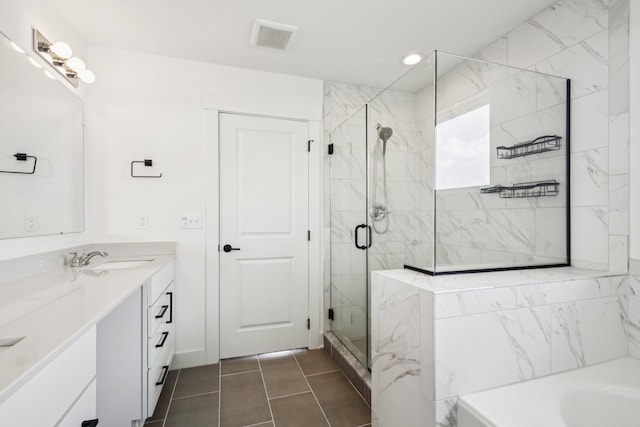 331 Honey Tree Way, Ann Arbor, MI 48103 - full bath featuring double vanity, a stall shower, a garden tub, and tile patterned flooring
