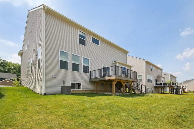 331 Honey Tree Way, Ann Arbor, MI 48103 - back of house with stairs, a deck, and a lawn
