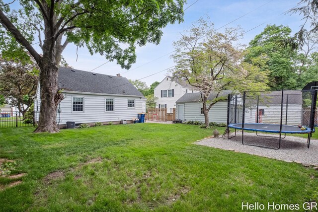 2052 Gorham Dr SE, East Grand Rapids, MI 49506 - view of yard featuring a trampoline and cooling unit