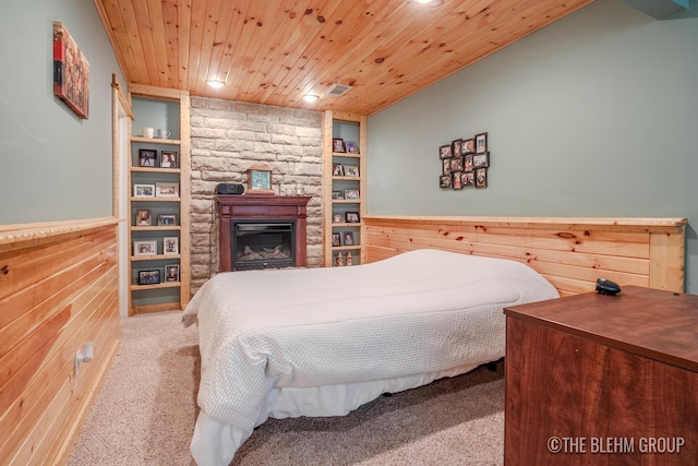 1705 Fritz St, Marne, MI 49435 - bedroom featuring carpet flooring, wooden ceiling, recessed lighting, wood walls, and a fireplace