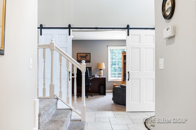 1705 Fritz St, Marne, MI 49435 - entryway featuring a barn door, stairs, and tile patterned floors