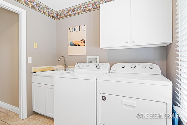 1705 Fritz St, Marne, MI 49435 - washroom with washing machine and dryer and cabinet space