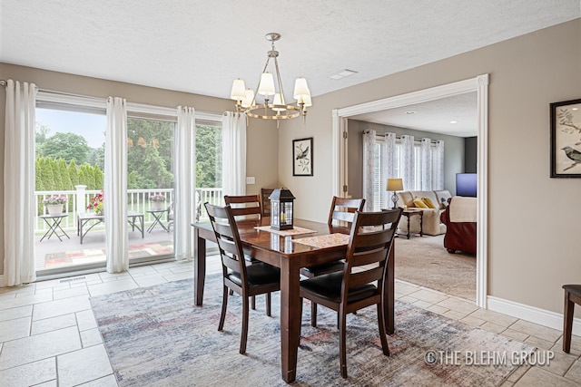 1705 Fritz St, Marne, MI 49435 - dining room featuring a chandelier, plenty of natural light, and a textured ceiling