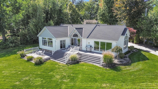 14776 Park Ct, Grand Haven, MI 49417 - rear view of property with roof with shingles, a yard, a wooden deck, and central AC unit