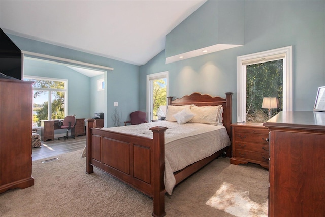 14776 Park Ct, Grand Haven, MI 49417 - bedroom featuring a desk, light carpet, and high vaulted ceiling
