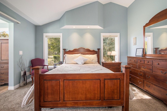 14776 Park Ct, Grand Haven, MI 49417 - bedroom with light colored carpet, vaulted ceiling, and baseboards