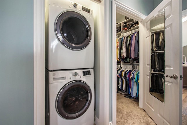 14776 Park Ct, Grand Haven, MI 49417 - laundry room with stacked washer / drying machine and carpet