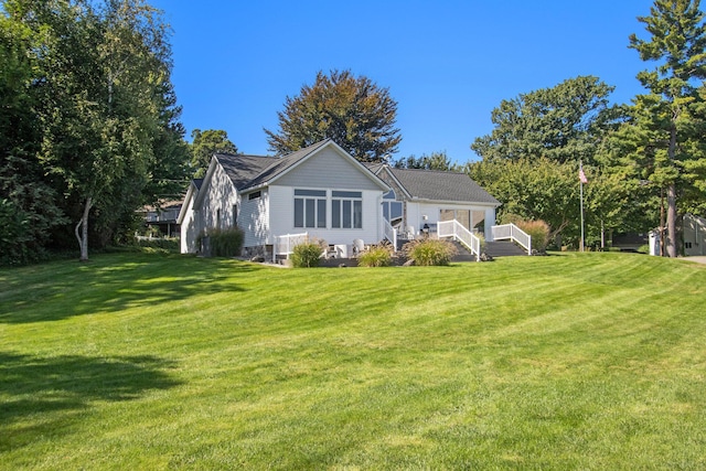 14776 Park Ct, Grand Haven, MI 49417 - rear view of property with a lawn