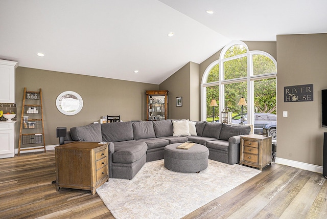 14776 Park Ct, Grand Haven, MI 49417 - living room featuring wood finished floors, lofted ceiling, baseboards, and recessed lighting
