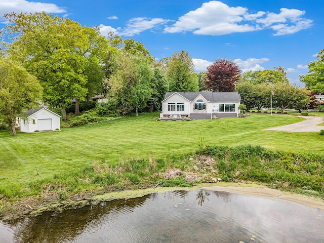 14776 Park Ct, Grand Haven, MI 49417 - rear view of property with an outdoor structure, a yard, and a detached garage