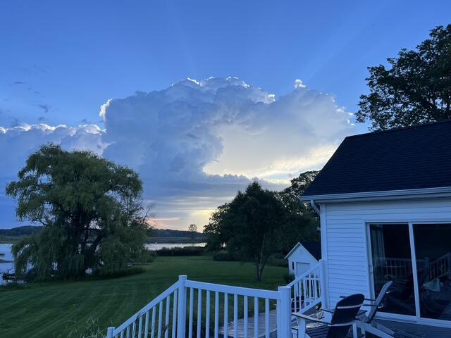 14776 Park Ct, Grand Haven, MI 49417 - yard at dusk featuring a yard and a deck with water view