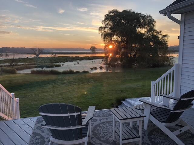 14776 Park Ct, Grand Haven, MI 49417 - yard at dusk with a water view and a lawn