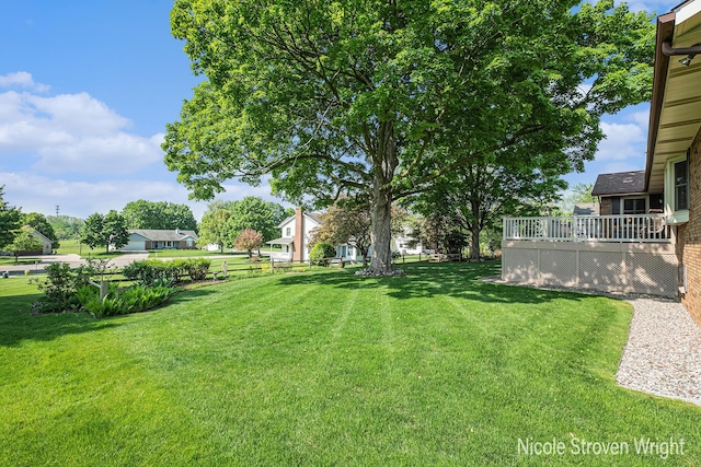 4124 Cummings Ct NW, Grand Rapids, MI 49534 - view of green lawn with a deck