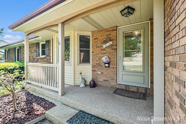 4124 Cummings Ct NW, Grand Rapids, MI 49534 - view of exterior entry with covered porch and brick siding